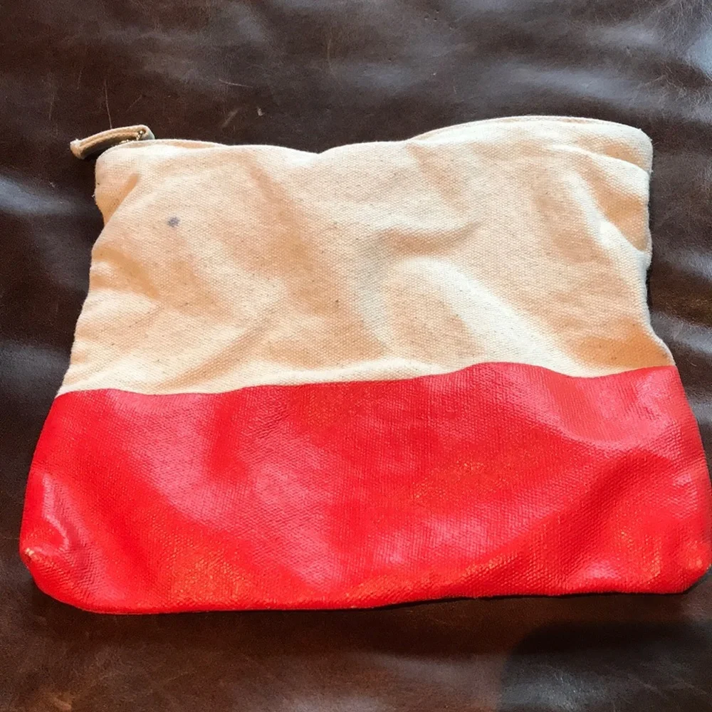 Cosmetic or pencil bag with vinyl orange bottom